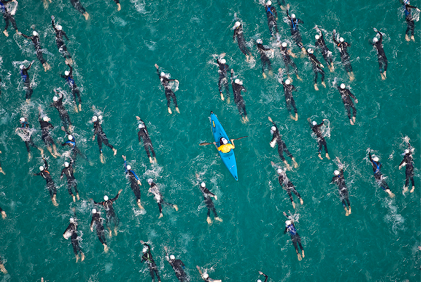 kayak with swimmers