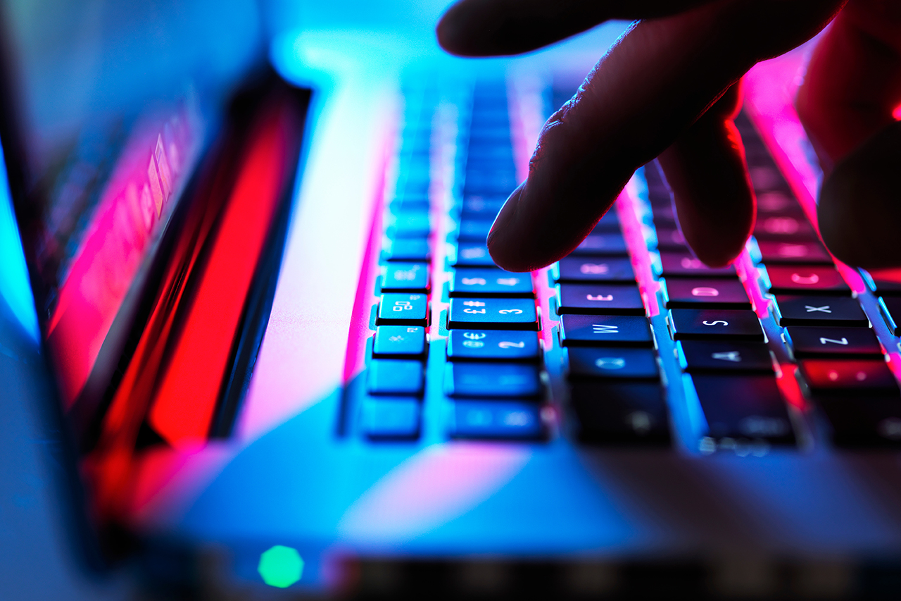 Fingers typing on keyboard