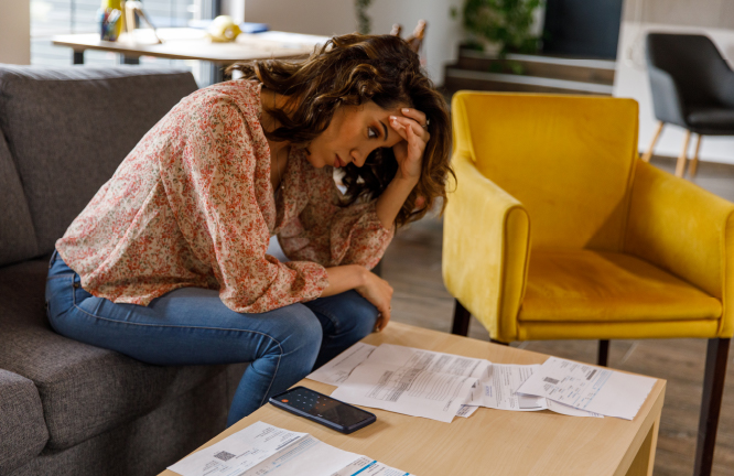 Woman looking at financial docs