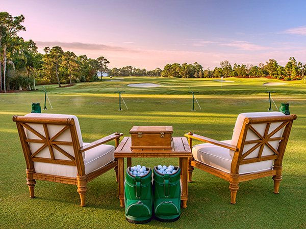 Chairs and golf balls on driving range