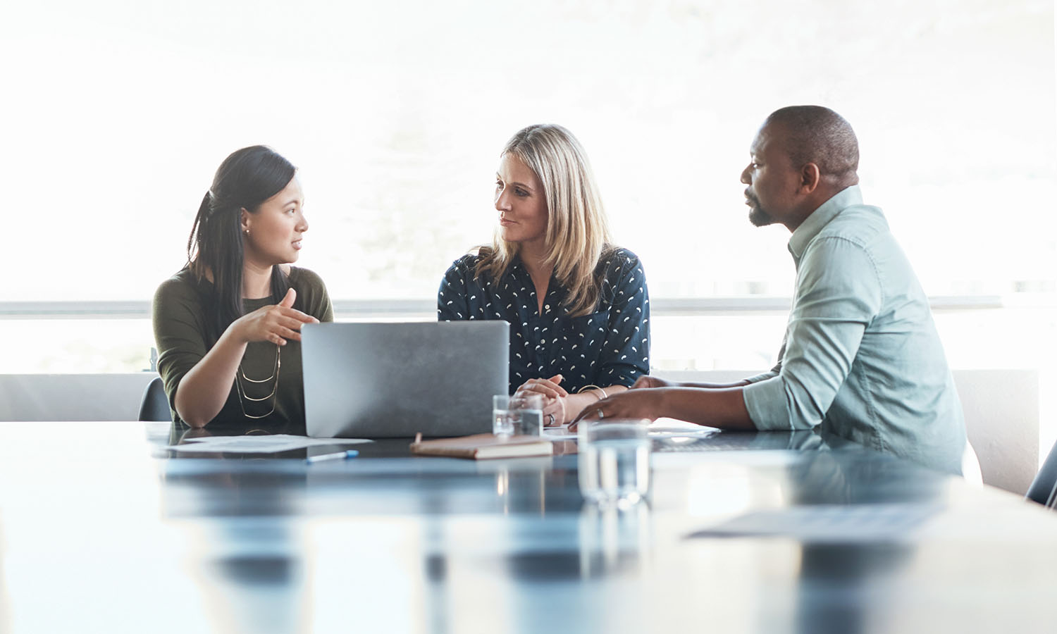 Shot of a group of businesspeople having a meeting in the boardroom of a modern office